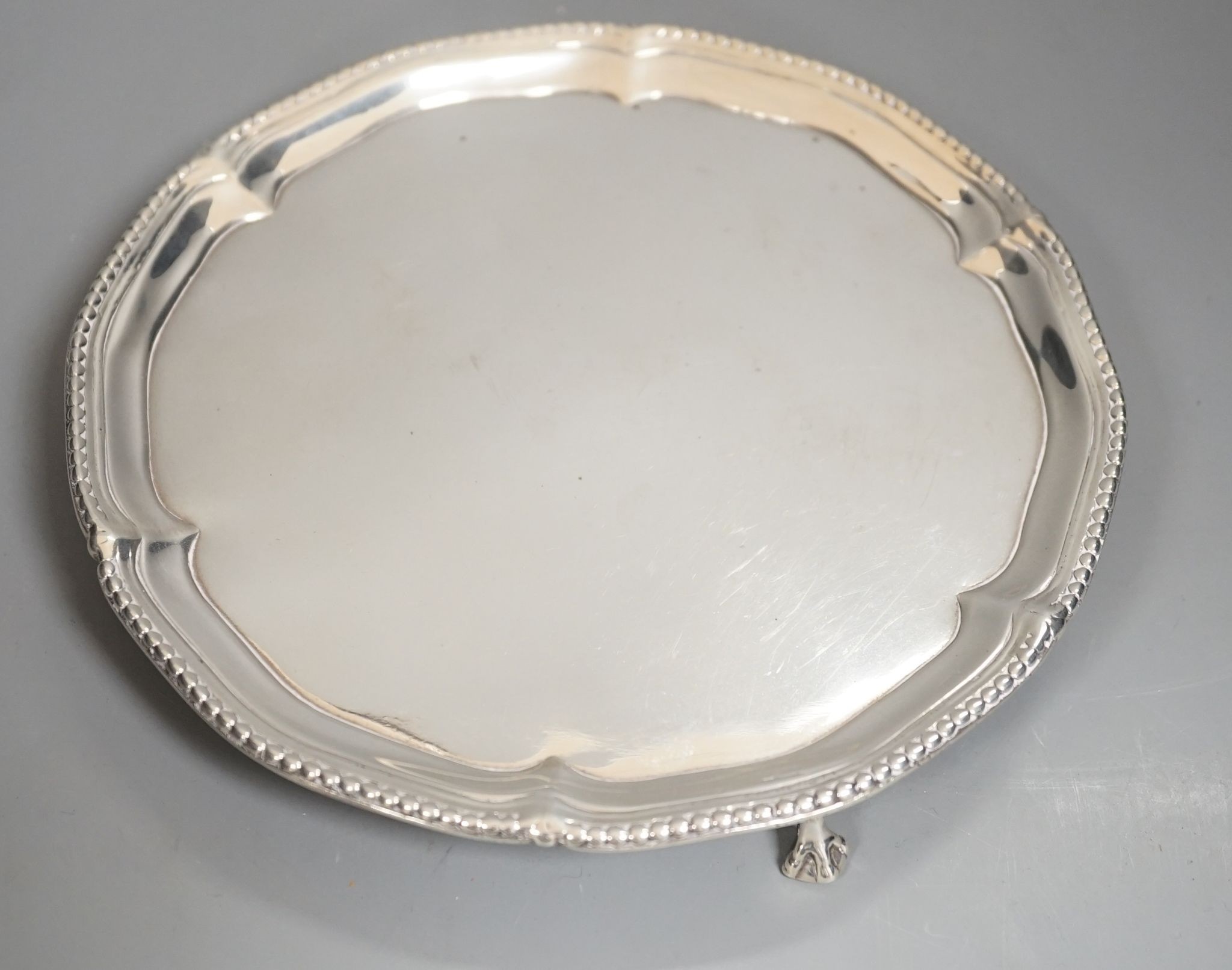 A George III silver waiter, on three claw feet, John Chapman II, London, 1774, 17.9cm, 8oz (repair).